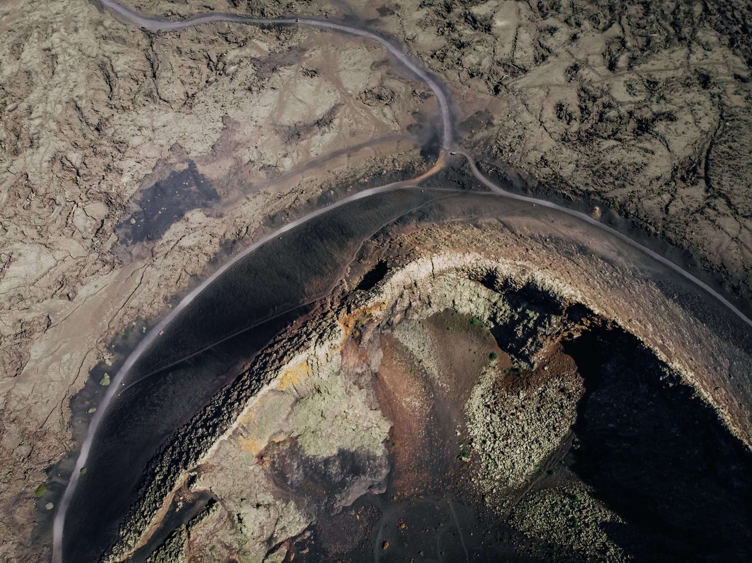 ground surface coated frozen lava aerial view scaled