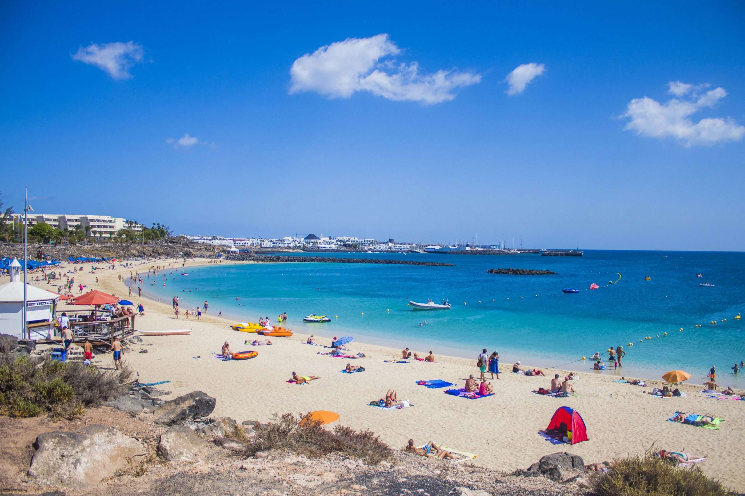 playa blanca in lanzarote in the summer afternoon with clear skies scaled